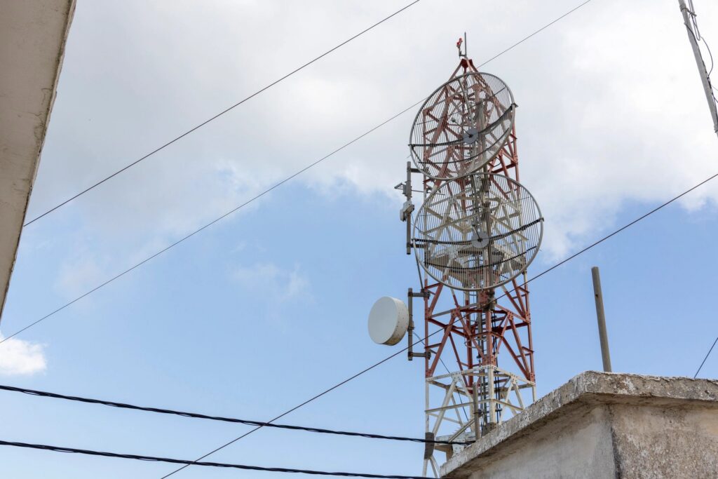 Telecommunication tower broadcasting communication signals on a clear day