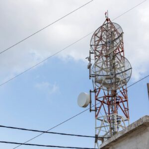 Telecommunication tower broadcasting communication signals on a clear day